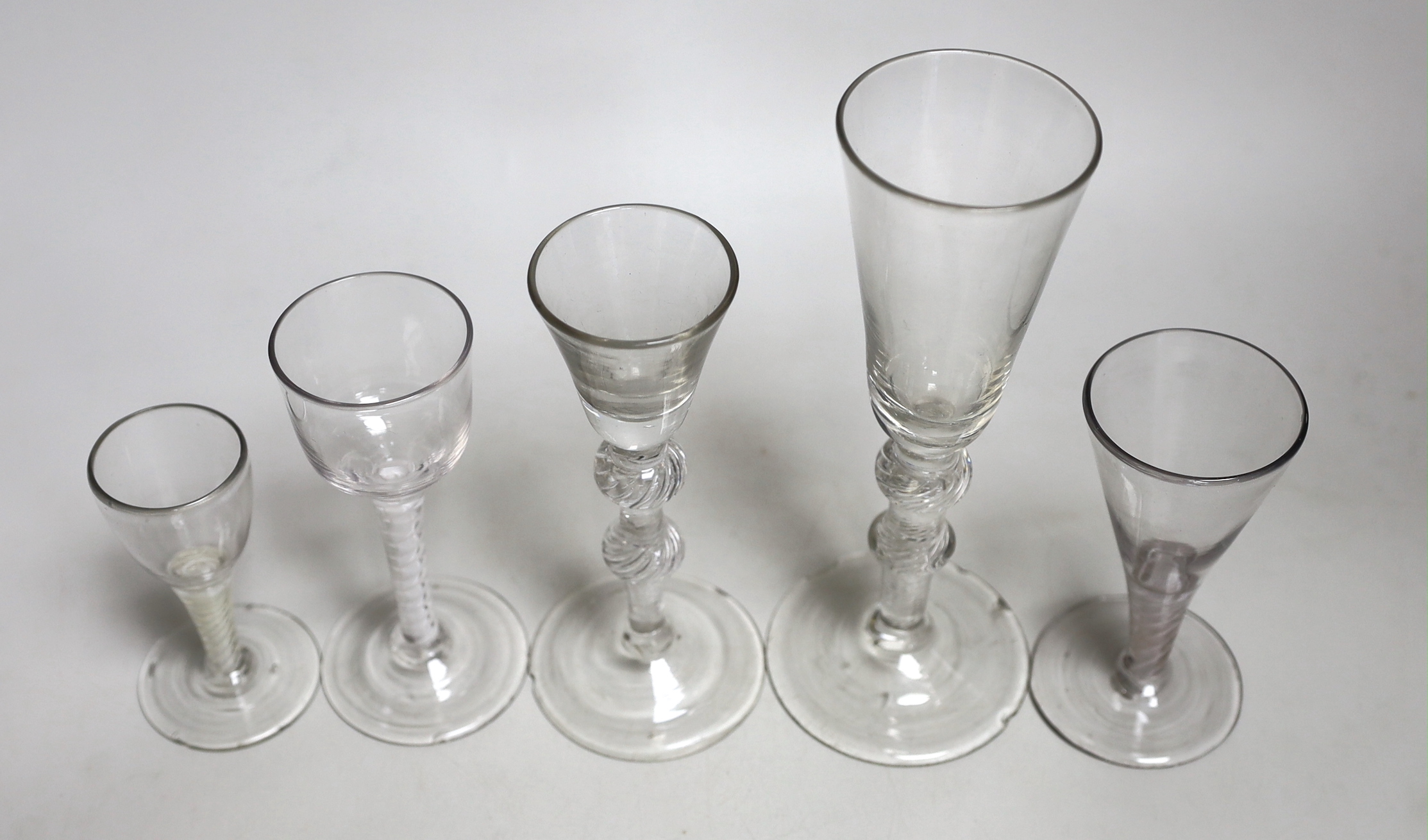 Two George II airtwist stem cordial or wine glasses, tallest 20cm high, a George III DSOT wine glass and two Continental DSOT glasses